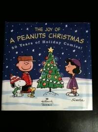 Item #27328 The Joy Of A Peanuts Christmas 50 Years Of holiday Comics! Charles Schultz