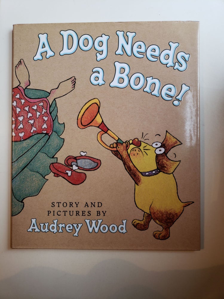 Item #41868 A Dog Needs a Bone. Audrey Wood.